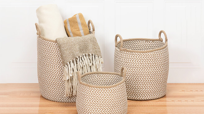 Three Preve Taupe & White Fabric Basket on the Floor