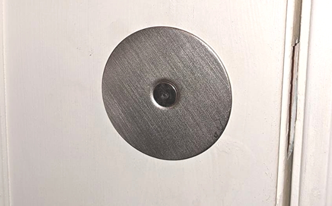 Prime Line Door Hole Cover Plate Installed on a Door