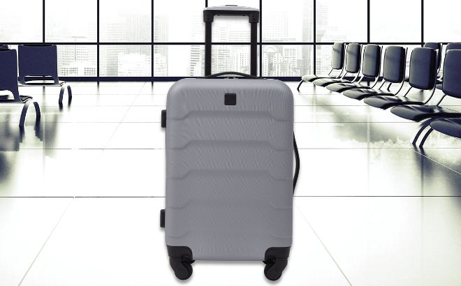 Protege 20 Inch Hard Side Rolling Carry on with 4 Wheels Spinner in Airport Waiting Lounge