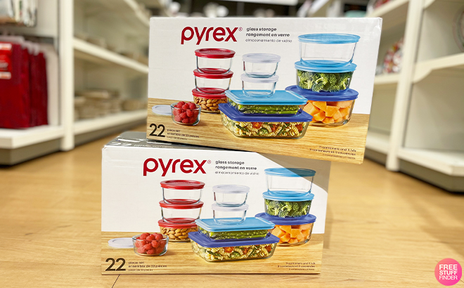 Two Pyrex 22 Piece Food Storage Sets on the Floor