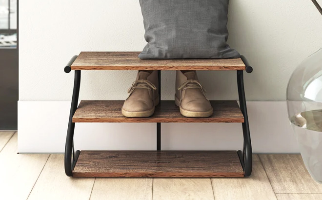 Rustic Brown Shoe Rack with pair of shoes and a pillow on top