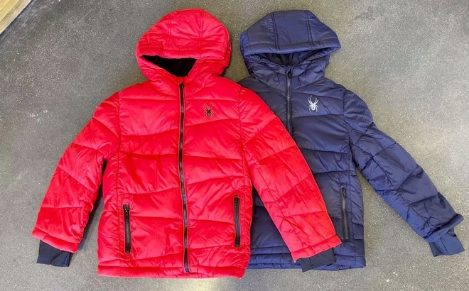 Spyder Boys Red and Blue Puffer Jackets Displayed on the Floor
