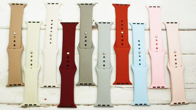 Ten Different Colors of Apple Watch Band on a White Wooden Table