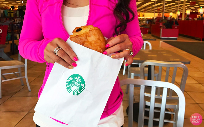 Tina Holding Pastry in a Bag at Starbucks