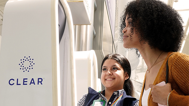 Two Women Using the Clear Airpod Security Pod Two Women Using the Clear Airpod Security Pod