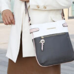 Woman Wearing MKF Collection Camilla Vegan Leather Womens Crossbody Handbag in Charcoal Blush Color