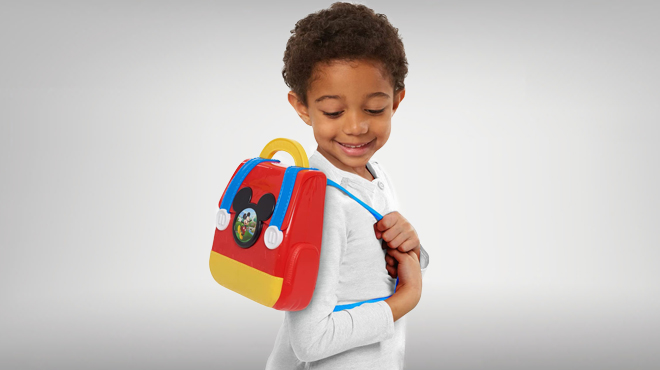 a Kid Carrying a Disney Junior Mickey Mouse Funhouse On the Go Doctor Bag