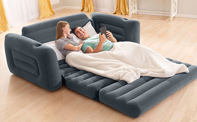 man and woman laying on a Intex Pull Out Inflatable Bed Series