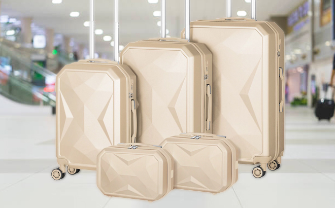 5 Piece Hardside Luggage Set in Beige Color on Airport Corridor