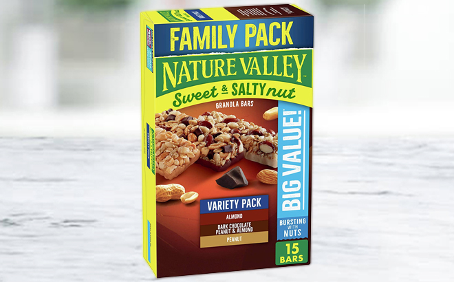 A Box of Nature Valley Sweet Salty Nut Variety Pack 15 Count on a Marble Tabletop