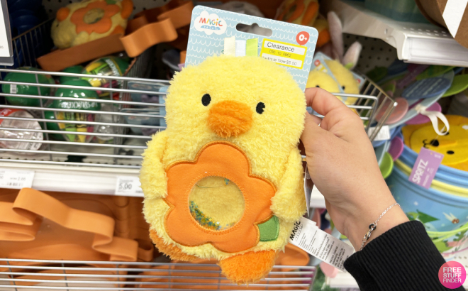 A Person Holding Magic Years 8 Inch Baby Seek and Squish Duck Toy