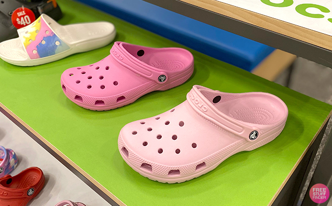 Crocs Classic Clogs in Various Pink Colors on a Shelf