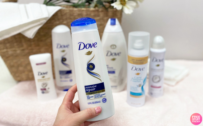 A Person Holding a Bottle of Dove Strengthening Repair Shampoo