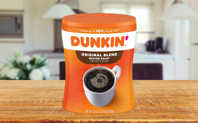 Dunkin' Original Blend Medium Roast Ground Coffee Canister on a Kitchen Table