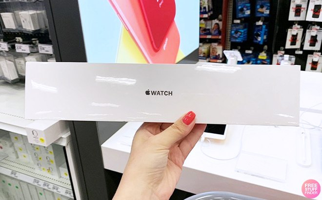 Hand Holding Apple Watch Box in a Store