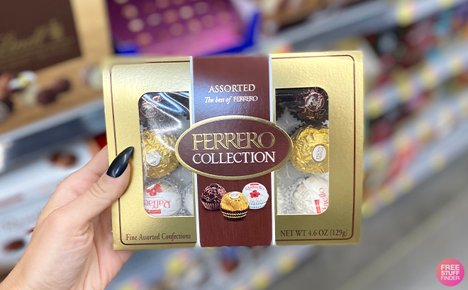 Hand Holding Ferrero Rocher Assorted Hazelnut Milk Chocolate 12 Count Gift Box