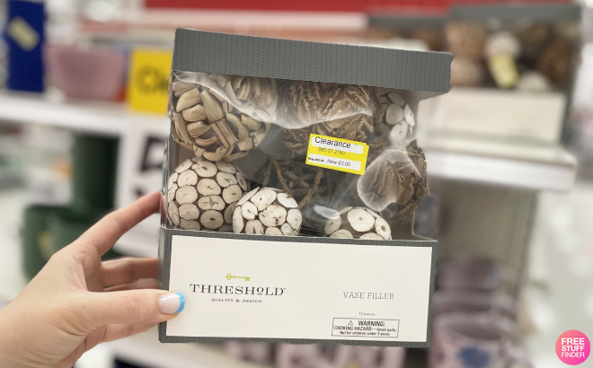 Hand Holding Threshold Vase Filler