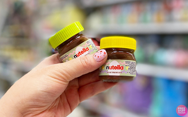 Hand Holding Two Nutella Easter Hazelnut Spread