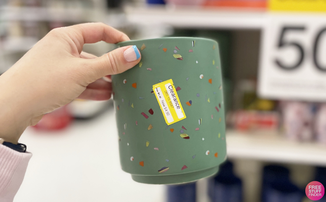 Hand Holding an Opalhouse Ceramic Planter in Green Color