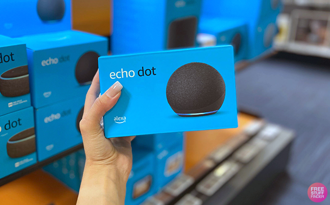 Hand holding Echo Dot 5th Generation Hand holding Echo Dot 5th Generation