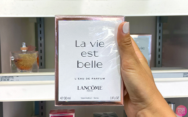 Hand holding Lancome La Vie Est Belle Eau de Parfum 1 Ounce