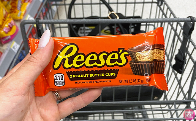 Hand holding Reeses Peanut Butter Cups