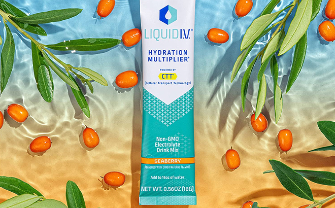Liquid I V Hydration Multiplier with Seaberry Flavor on Water with Fruit and Leaves on the Side