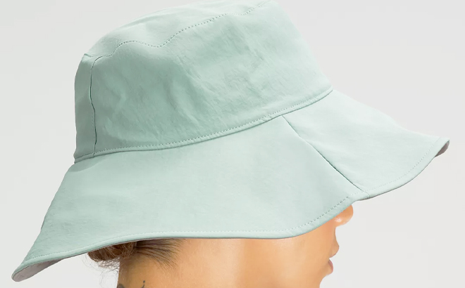 Lululemon Womens Wide Brim Logo Bucket Hat Tidewater Teal Color with Woman Lululemon Womens Wide Brim Logo Bucket Hat Tidewater Teal Color with Woman