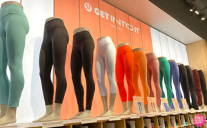 Mannequins Wearing Various Colors and Styles of Lululemon Leggings on a Store Shelf