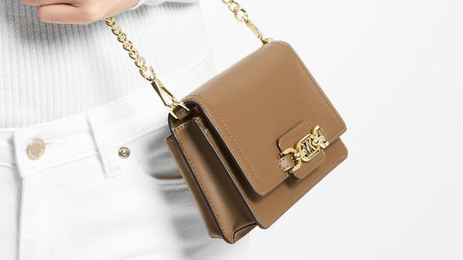 Model Wearing Michael Kors Heather Small Crossbody Bag in Brown Model Wearing Michael Kors Heather Small Crossbody Bag in Brown