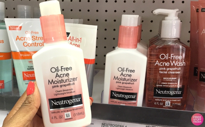 Neutrogena Oil Free Acne Facial Moisturizer with Salicylic Acid Acne Treatment Held in Hand in Store