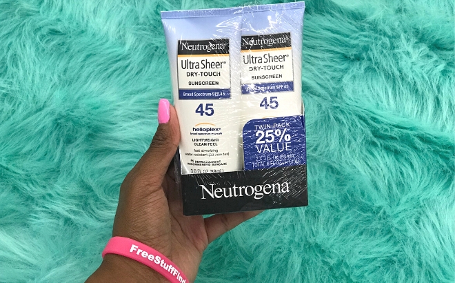 Neutrogena Ultra Sheer Dry Touch Water Resistant and Non Greasy Sunscreen Lotion with Broad Spectrum SPF 45 2 Pack Held in Hand