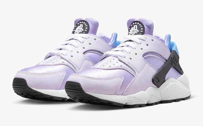 Nike Air Huarache Womens Shoes in Lilac Color on Gray Background
