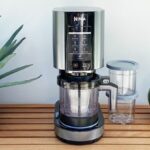 Ninja CREAMi Ice Cream Gelato Sorbet Maker on a Wooden Counter