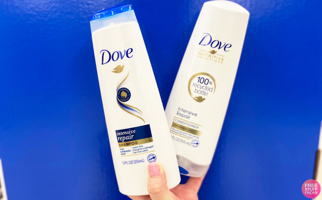 Person Holding Dove Strengthening Repair Shampoos