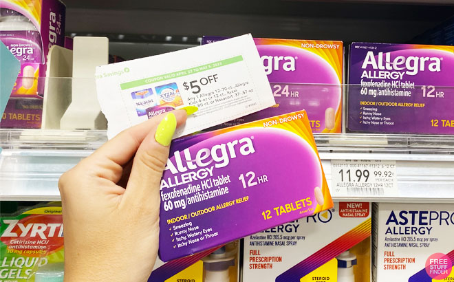 Person Holding a Coupon and a 12 Tablet Box of Allegra