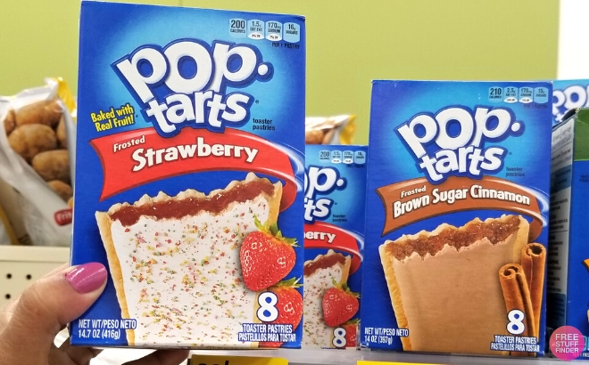 Pop Tarts Toaster Pastries 8 Count in Frosted Strawberry Flavor Held in Hand in Store