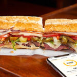 Potbelly Original Sandwich on a Table and a Phone Showing Potbelly Perks Membership