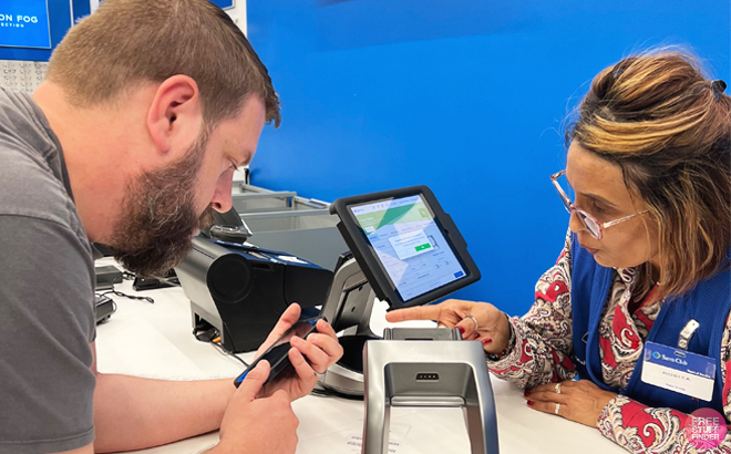 Customer at the Member Service Station inside a Sam's Club Store Customer at the Member Service Station inside a Sam's Club Store