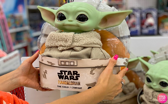 Star Wars The Mandalorian The Child aka Baby Yoda Plush by Mattel Held in Hand in a Store
