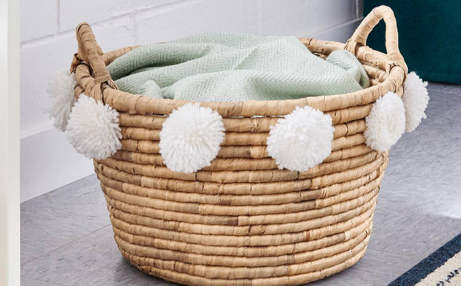 Stylewell Oval Natural Water Hyacinth Decorative Basket with White Pompom Balls