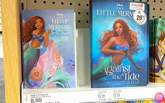 The Little Mermaid Live Action Novelization Paperback and The Little Mermaid Against the Tide EXCL Hardcover on a Shelf