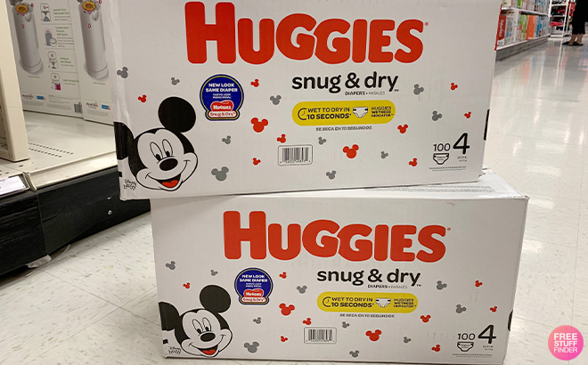 Two Huggies Snug and Dry Diapers 100 Count Boxes in a Store Aisle