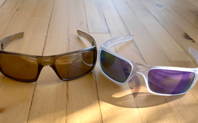 Two Pairs of Oakley Mens Crankshaft Polarized Sunglasses on Wooden Floors