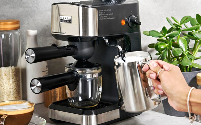 Woman Using the Frother of the Bella Pro Series Steam Espresso Machine