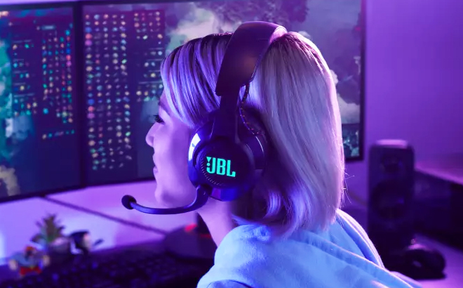 Woman Wearing JBL Quantum 600 Wireless Over Ear Performance Gaming Headset Woman Wearing JBL Quantum 600 Wireless Over Ear Performance Gaming Headset