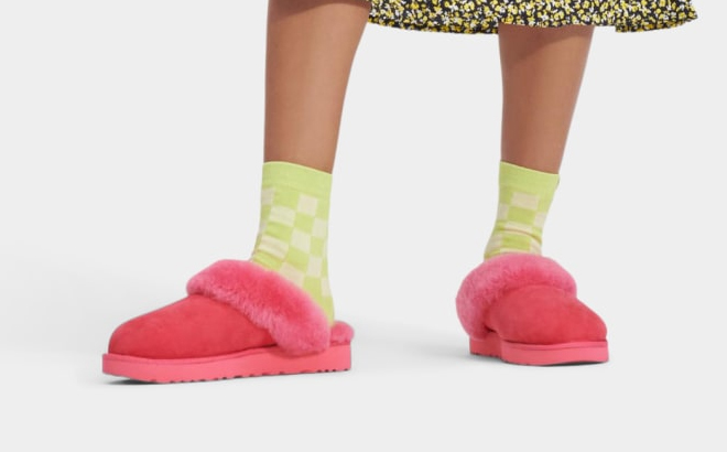 a Person Wearing a Pair of UGG Classic Slipper II Pink Color
