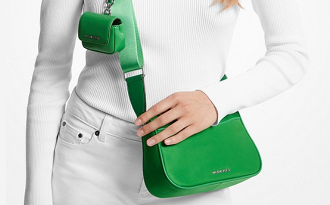 Woman Wearing Michael Kors Crossbody Bag with Case for AirPods Pro