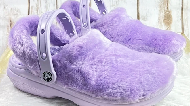 A Pair of Crocs Classic Fur Sure Clogs in Lavender Color