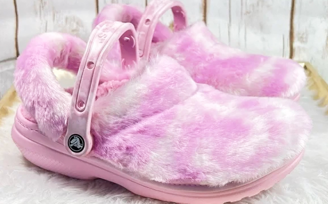 A Pair of Crocs Classic Fur Sure Clogs in Pink Color